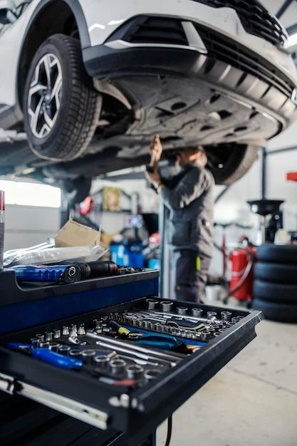 Peugeot 3008 on a lift during a scheduled service at RHP GARAGE